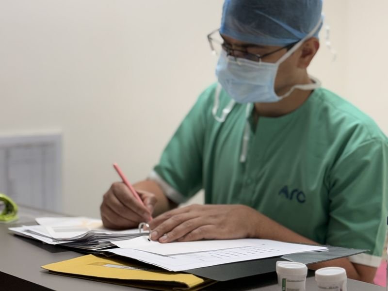 Dr Prabhat Yaji reviewing a patient's reports at ARC Cancer Hospital